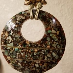 Necklace with resin pendant that looks stone